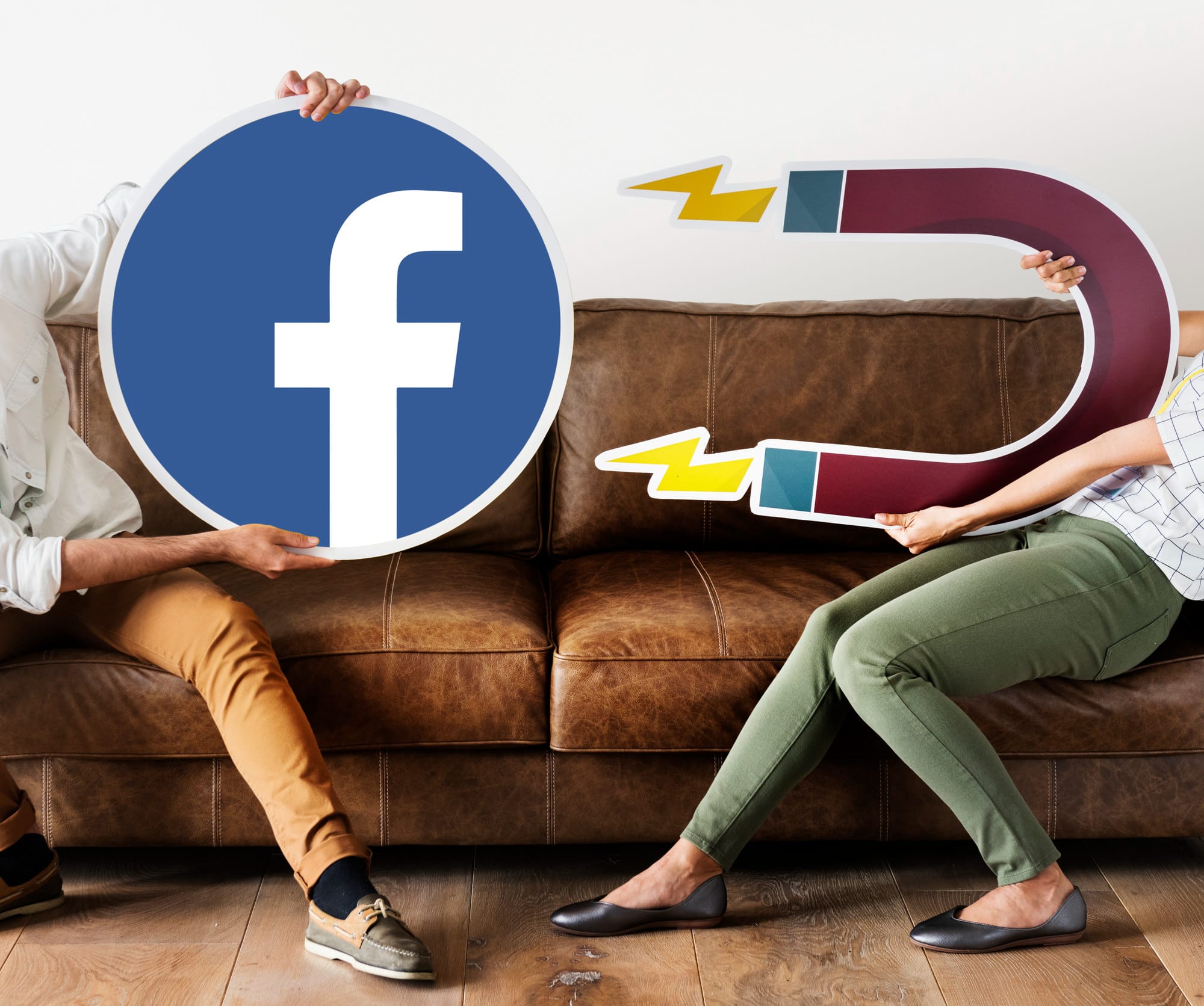 People holding a facebook and magnet icon 