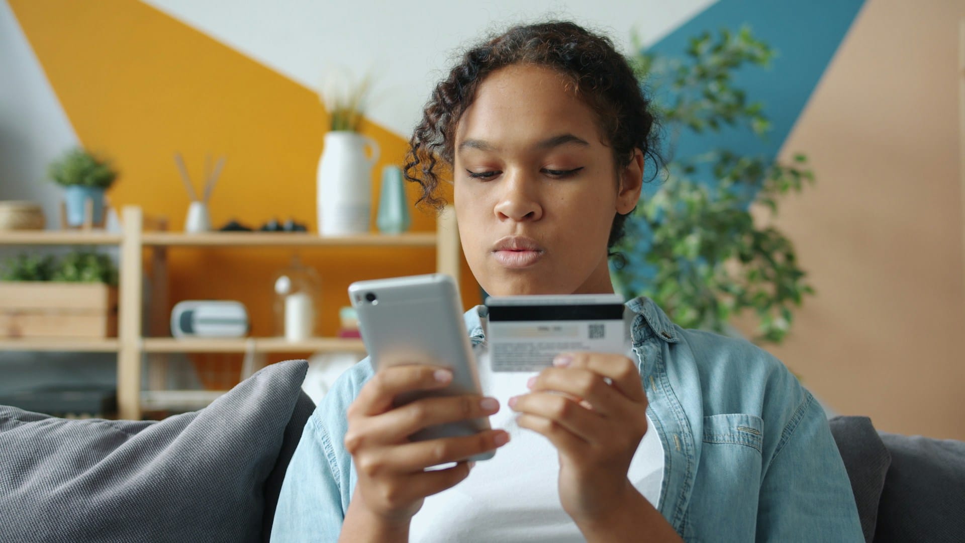 A woman checking her credit card details 